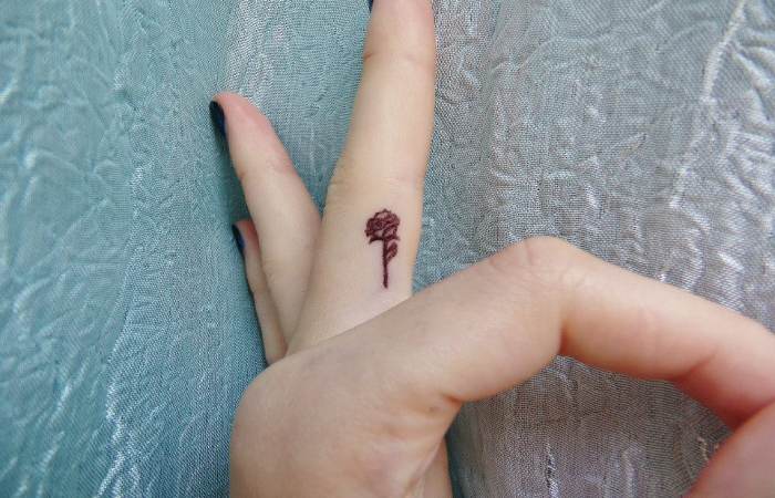 Two Delicate Finger Tattoos